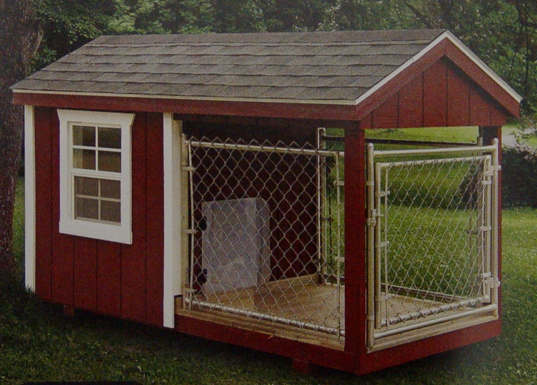 Wood dog kennel shed with a chain-link run and covered porch.